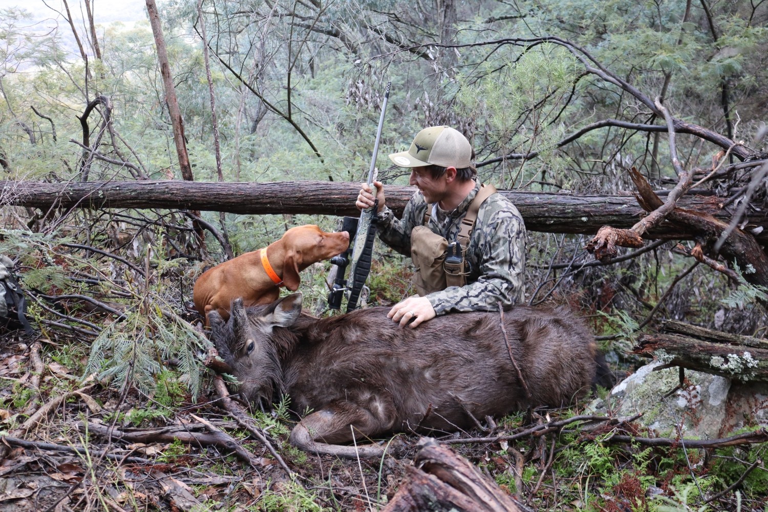 Jared sitting with the bull of every Moose hunters’ dreams.